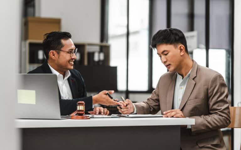 Customised insurance broker consultation in a modern office setting.