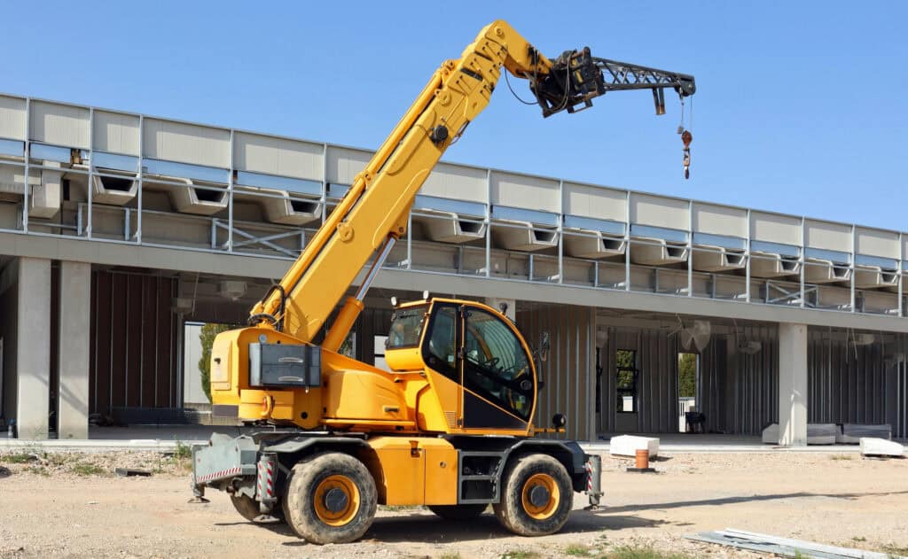 Construction site forklift truck at a building site, highlighting industrial machinery and construction equipment.