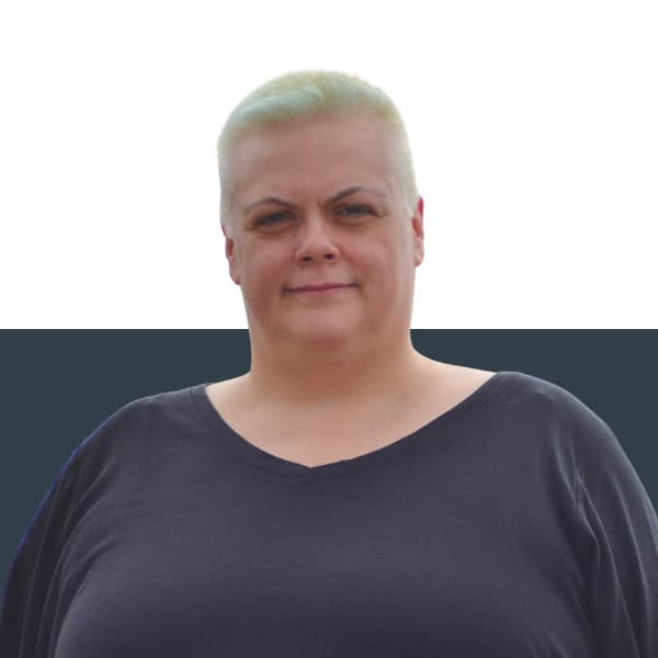 Competent woman insurance broker standing outdoors for Jensten Insurance Brokers UK.