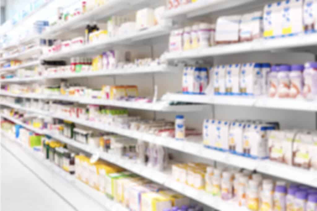 Vast assortment of pharmacy products on shelves at a retail store, showcasing health and wellness items.