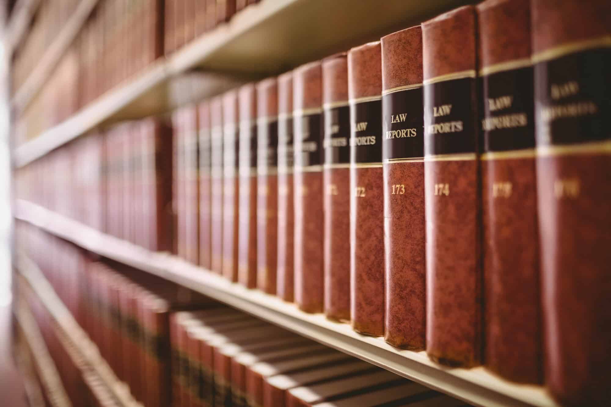 Close-up of shelves filled with thick law reports in a legal library, symbolising solicitors’ regulatory obligations and the growing complexity of anti-money laundering requirements.