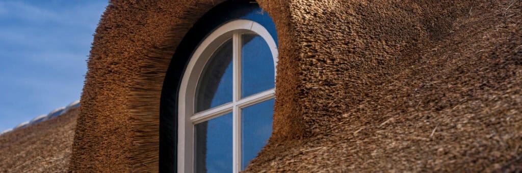 Header banner for thatched insurance guide on 7 things to consider when insuring your thatched property